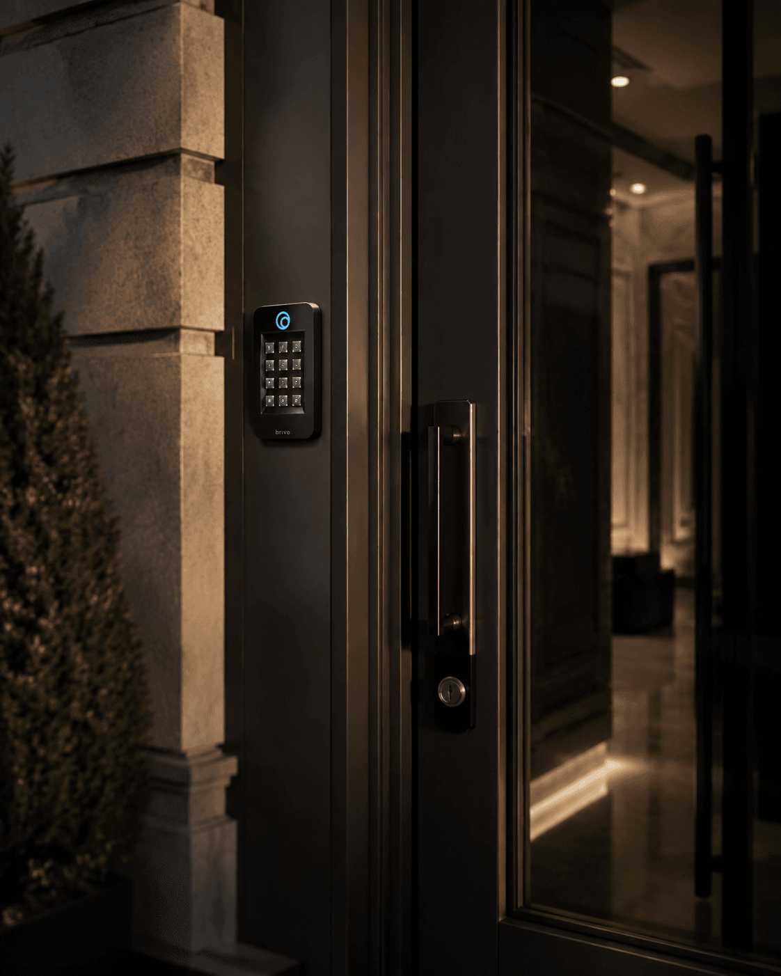 Keypad access reader installed beside a modern entrance door